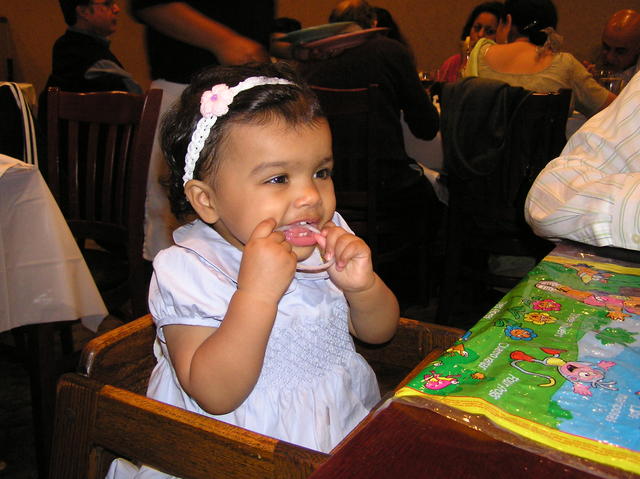 Kayla eating a raw onion