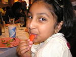 Not so adventurous Maya with a raw tomato...