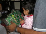 Kayla opens her first gift