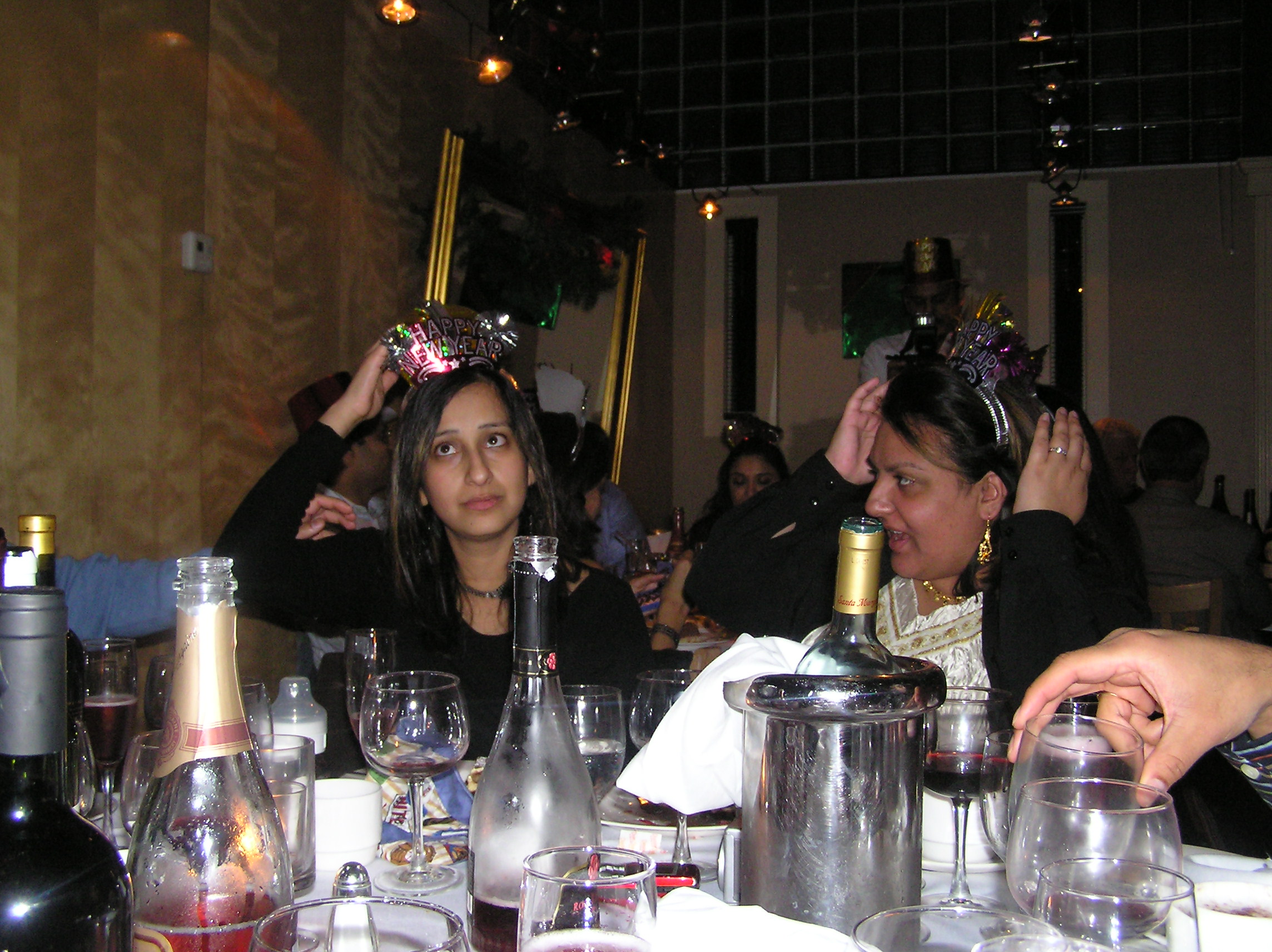 Jigna and Priti fixing their hats