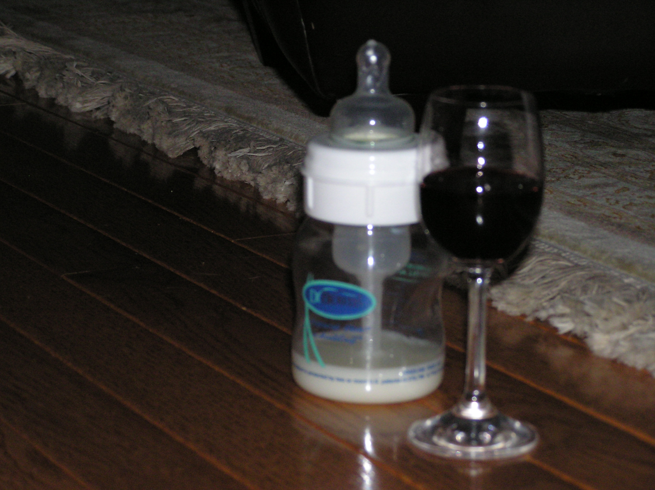 Baby's bottle and Daddy's glass