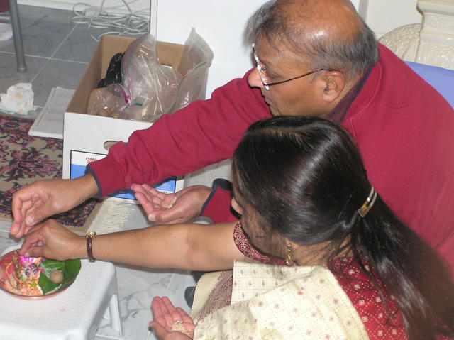 Rajoo Foi and Ramesh Fuaji doing puja
