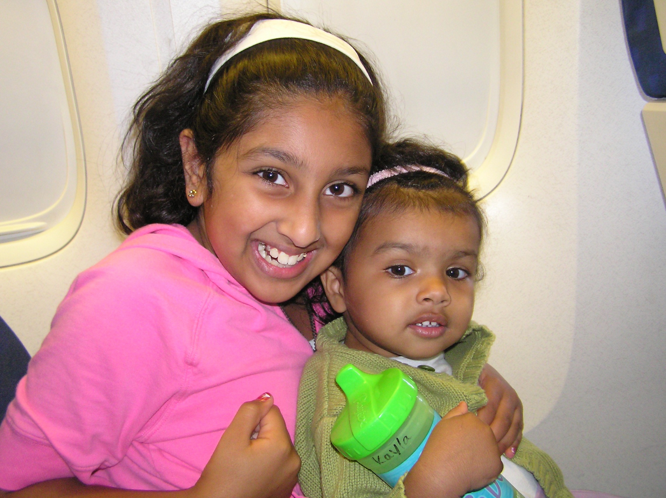 Maya and Kayla on the plane