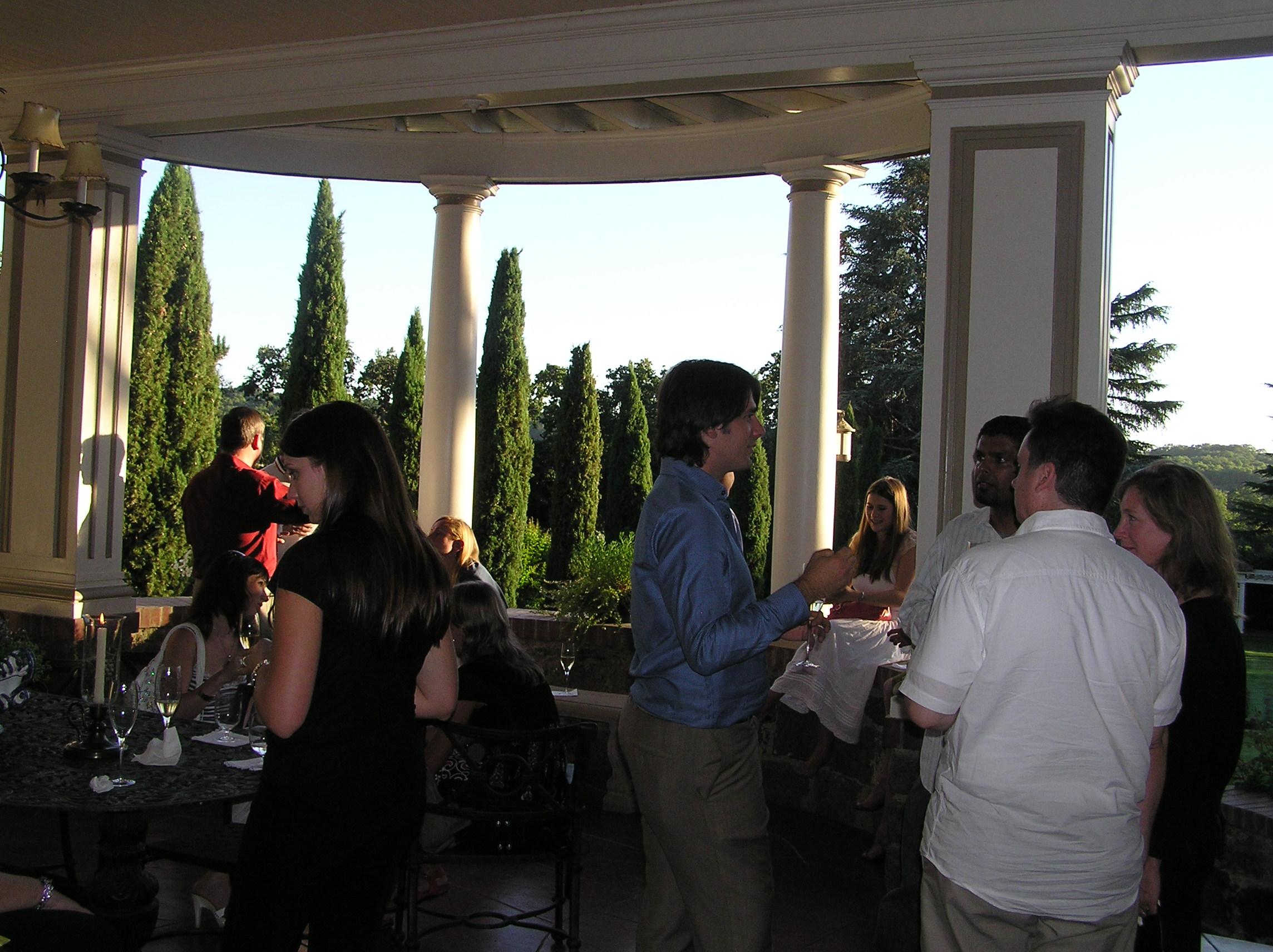 On the patio overlooking a gorgeous garden and lawn