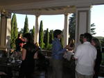 On the patio overlooking a gorgeous garden and lawn
